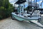 Shallow Master 270 SMC - 2024 Shallow Master 270 SMC boat on trailer, parked outdoors.