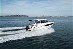 Bayliner T25 EXPLORER - 2024 Bayliner T25 EXPLORER cruising on open water, showcasing sleek design and performance.