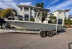 Pathfinder 2500 Hybrid - 2019 Pathfinder 2500 Hybrid boat on trailer, parked in residential area.