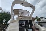 Sea Ray 450 Express Bridge - 2001 Sea Ray 450 Express Bridge yacht with upper deck and seating area.