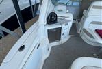 Sea Ray 320 Sundancer - 2006 Sea Ray 320 Sundancer interior with seating, sink, and storage.