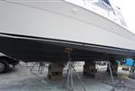 Sea Ray 340 Amberjack - Sea Ray 340 Amberjack 2002 on dry dock, supported by stands and blocks.