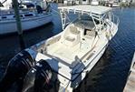 Pursuit 2800 Open - 1992 Pursuit 2800 Open boat docked with dual Suzuki engines.