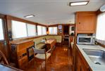 Grand Banks 42 Classic - Interior of 1985 Grand Banks 42 Classic yacht with wood finishes and cozy seating area.