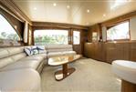 Viking Sportfish - Luxurious interior of a 2006 Viking Sportfish yacht with elegant seating and wooden finishes.