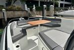 Jeanneau Leader 9.0 CC - 2023 Jeanneau Leader 9.0 CC boat with spacious seating and wooden table.