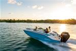 Bayliner M17 - 2024 Bayliner M17 boat cruising on a lake at sunset.