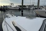 Blackfin 29 Combi - 1992 Blackfin 29 Combi boat docked at marina under cloudy sky.