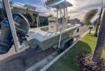 Pathfinder 2500 Hybrid - 2019 Pathfinder 2500 Hybrid boat on trailer, parked in a sunny residential area.