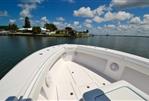 SeaHunter 33 - 2018 SeaHunter 33 boat on calm water, clear sky, and coastal view.