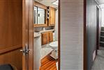 Ocean Yachts 48 Super Sport - Interior bathroom of 1987 Ocean Yachts 48 Super Sport with wooden cabinetry and flooring.