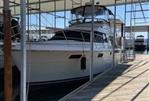 Carver 4207 - 1987 Carver 4207 yacht docked in a covered marina.