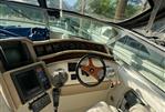 Sea Ray 500 - Interior cockpit of 1995 Sea Ray 500 yacht with steering wheel and navigation equipment.