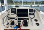 Pursuit S 280 Sport - 2011 Pursuit S 280 Sport boat dashboard with steering wheel and navigation controls.