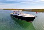 MJM 36z Downeast - 2015 MJM 36z Downeast boat on calm water, scenic marshland background.