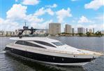 Amer 94 - Luxurious 2017 Amer 94 yacht cruising on a scenic waterfront with city skyline.