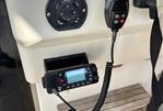 Pursuit 2800 Open - 1992 Pursuit 2800 Open boat control panel with radio and Jabsco switch.