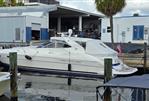 Neptunus 5616 - Neptunus 5616 yacht docked at marina, 2000 model, white exterior, covered cockpit.