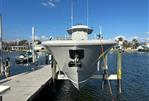 Yellowfin 36 Offshore - 2016 Yellowfin 36 Offshore boat docked at marina under clear blue sky.