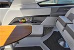 Four Winns H350 - Interior of 2019 Four Winns H350 boat with seating and wooden table.