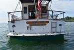 Island Gypsy Sedan - 1989 Island Gypsy Sedan boat named "Takes Two" on calm water.