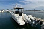 Boston Whaler 325 Conquest Pilothouse - 2020 Boston Whaler 325 Conquest Pilothouse docked with twin outboard engines.