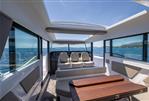 Axopar 45 - Interior of 2024 Axopar 45 boat with panoramic windows and modern seating.