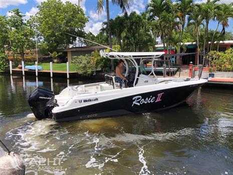 Wellcraft 262 Fisherman - 2021 Wellcraft 262 Fisherman boat named Rosie II cruising in a tropical canal.