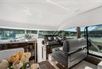 Prestige 520 - Luxurious 2024 Prestige 520 yacht interior with modern helm and elegant seating.