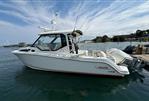 Boston Whaler 325 Conquest Pilothouse - 2020 Boston Whaler 325 Conquest Pilothouse boat docked on calm water.