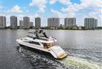 Amer 94 - Luxurious 2017 Amer 94 yacht cruising near city skyline under blue skies.