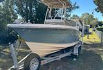 Scout 215 XSF - 2018 Scout 215 XSF boat on trailer in residential yard.