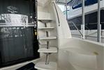 Carver 56 Voyager Sky lounge - Staircase on 2004 Carver 56 Voyager Sky Lounge yacht, docked in marina.