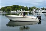 Pursuit C 280 Center Console - 2012 Pursuit C 280 Center Console boat on calm water near marina.