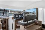 Prestige 590 flybridge - Luxurious interior of 2024 Prestige 590 flybridge yacht with modern helm station.