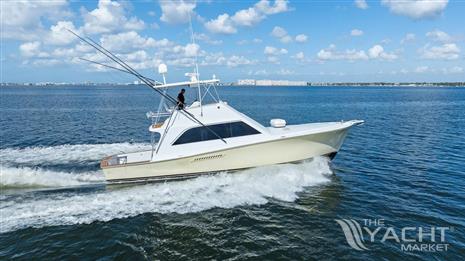 Ocean Yachts 48 Super Sport - 1987 Ocean Yachts 48 Super Sport cruising on open water under a clear blue sky.