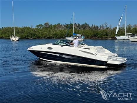 Sea Ray 260 Sundeck - 2014 Sea Ray 260 Sundeck boat cruising on a calm river.