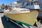 Padebco V27 Center Console - 2003 Padebco V27 Center Console boat on trailer, parked near a building.