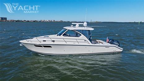 Pursuit OS 355 Offshore - 2018 Pursuit OS 355 Offshore boat cruising on open water.