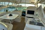 Fairline Targa 52 GT - Luxurious interior of 2003 Fairline Targa 52 GT yacht with elegant seating and table.