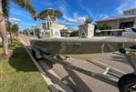 Pathfinder 2500 Hybrid - 2019 Pathfinder 2500 Hybrid boat on trailer, sunny day, residential street.