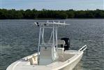 Pathfinder 2300 HPS - 2017 Pathfinder 2300 HPS boat on calm water, clear sky background.