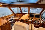 Sabre 40 Sedan - Interior of 2011 Sabre 40 Sedan yacht with wooden finish and modern controls.