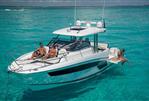 Jeanneau Leader 12.5 WA - 2023 Jeanneau Leader 12.5 WA cruising in clear turquoise waters.