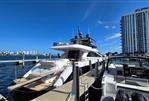 Amer 94 - Luxury yacht Amer 94, 2017 model, docked at a marina with city skyline in the background.