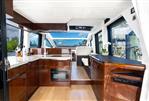 Galeon 47 Sky - Luxurious interior of 2022 Galeon 47 Sky yacht with modern kitchen and panoramic windows.