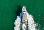 Prestige 420 - Aerial view of 2020 Prestige 420 yacht cruising on turquoise water.