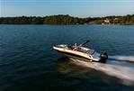 Bayliner VR6 - 2023 Bayliner VR6 speedboat cruising on a serene lake.