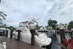 Sea Ray 450 Express Bridge - 2001 Sea Ray 450 Express Bridge docked by waterfront homes.