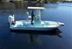 Shallow Sport 24 Mod V - 2021 Shallow Sport 24 Mod V boat on calm water with a person standing.